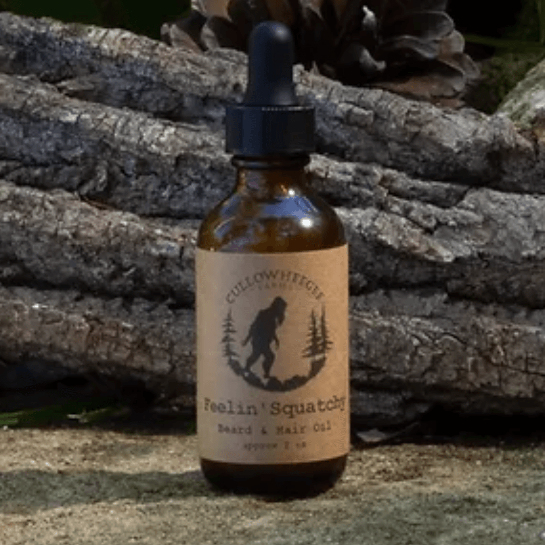 Amber glass bottle with brown label sitting on ground-Winchester Creek Farm