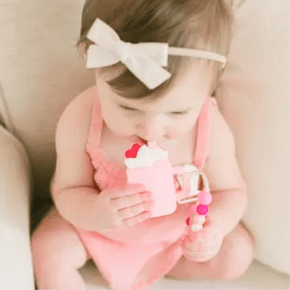 Baby teething on pink teether-Winchester Creek Farm